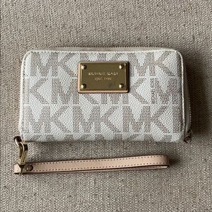 Michael Kors white & gold wristlet wallet.